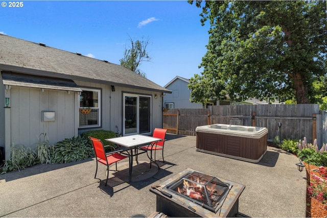 33447 SW Sequoia St, Scappoose, OR 97056 - fenced backyard featuring a hot tub, a patio area, a fire pit, and outdoor dining space