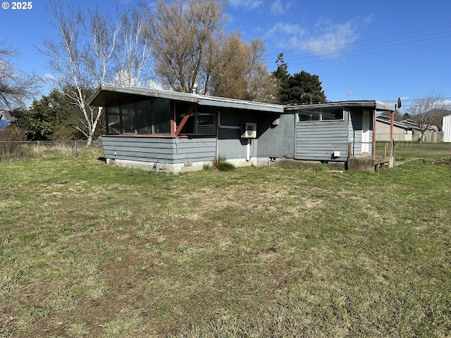 view of front of home featuring crawl space, a front yard, and fence