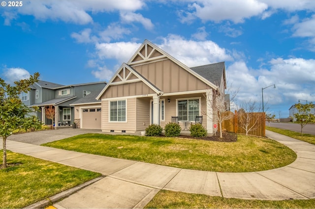 craftsman-style home with aphalt driveway, a porch, an attached garage, board and batten siding, and a front yard