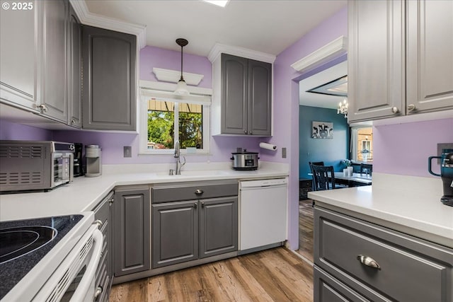 1650 NW Lakeway Ln, Beaverton, OR 97006 - kitchen with dishwasher, gray cabinets, light wood finished floors, light countertops, and a chandelier
