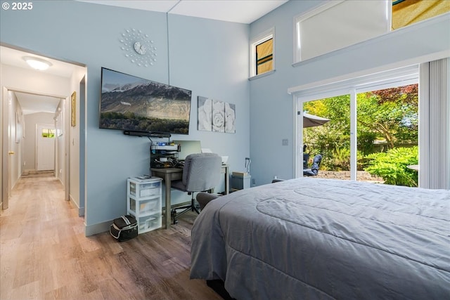1650 NW Lakeway Ln, Beaverton, OR 97006 - bedroom featuring wood finished floors, baseboards, a high ceiling, and an office area