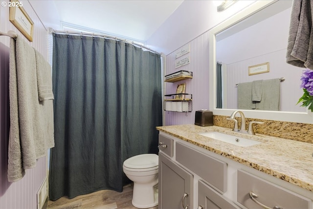 1650 NW Lakeway Ln, Beaverton, OR 97006 - full bath featuring vanity, wood finished floors, toilet, and a shower with shower curtain