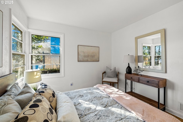 bedroom with visible vents and baseboards