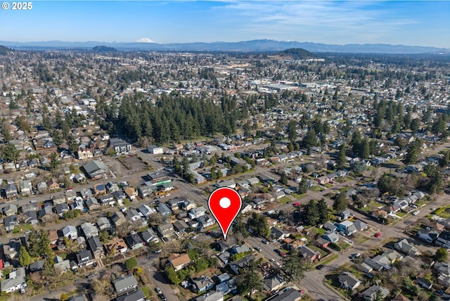 birds eye view of property featuring a mountain view