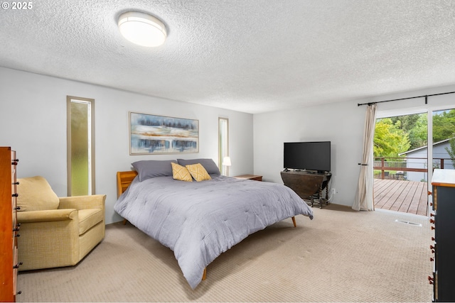 17954 NW Andria Ave, Portland, OR 97229 - carpeted bedroom with a textured ceiling and access to outside