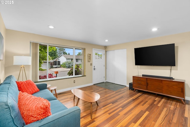 17954 NW Andria Ave, Portland, OR 97229 - living room with wood finished floors, recessed lighting, and baseboards