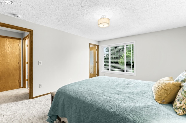 767 SW 8th St, Gresham, OR 97080 - carpeted bedroom featuring a textured ceiling and baseboards