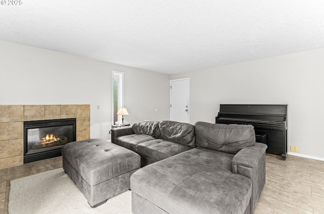 767 SW 8th St, Gresham, OR 97080 - living room featuring a tile fireplace and baseboards