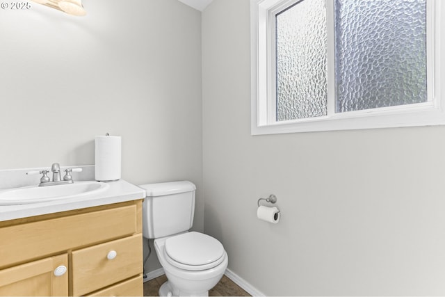 767 SW 8th St, Gresham, OR 97080 - bathroom with toilet, baseboards, vanity, and healthy amount of natural light