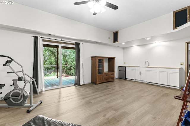 767 SW 8th St, Gresham, OR 97080 - workout room with light wood finished floors, a ceiling fan, and a sink