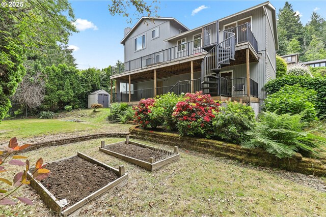 767 SW 8th St, Gresham, OR 97080 - rear view of house featuring a vegetable garden, a lawn, and stairs