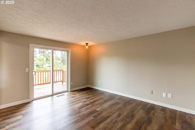 12190 SW Merestone Ct, Tigard, OR 97223 - unfurnished room featuring dark wood finished floors, baseboards, and a textured ceiling