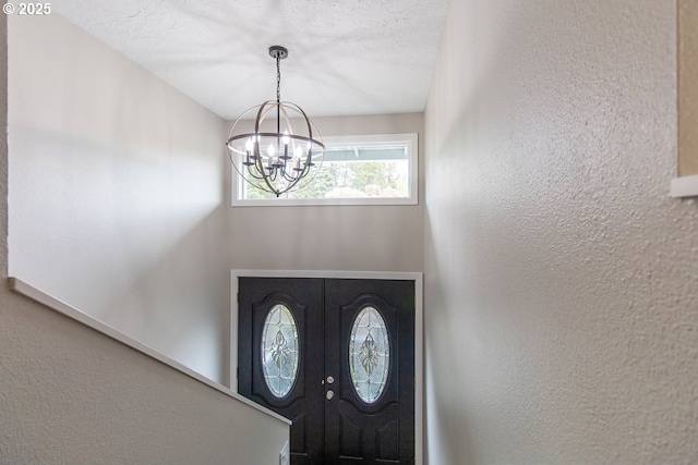 12190 SW Merestone Ct, Tigard, OR 97223 - foyer with a chandelier and a textured wall
