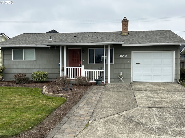 ranch-style home featuring a garage and a front lawn