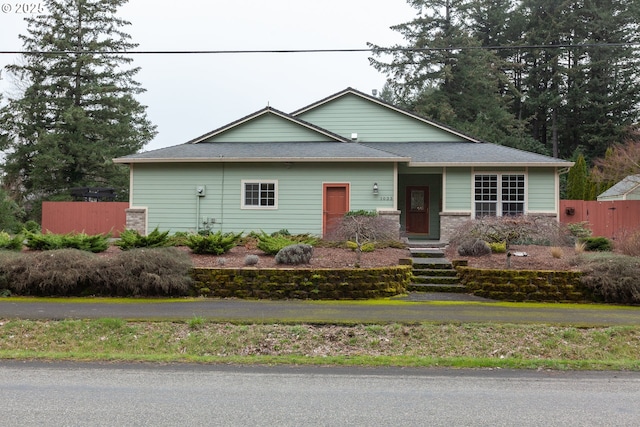 view of front of house featuring fence