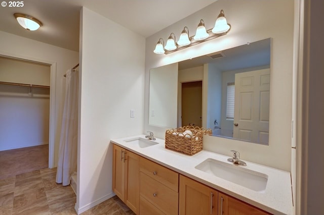 89650 Sea Breeze Dr, Warrenton, OR 97146 - full bath with double vanity, a shower with shower curtain, and baseboards