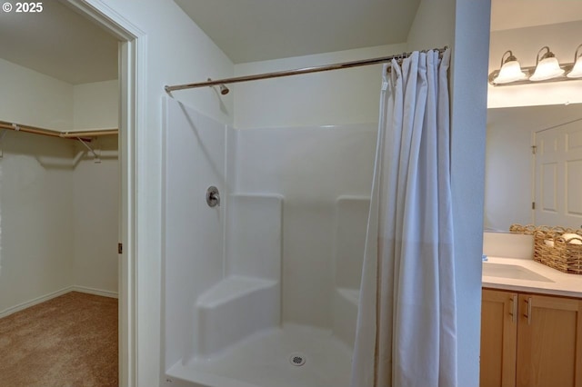 89650 Sea Breeze Dr, Warrenton, OR 97146 - full bath with a shower with curtain, a spacious closet, vanity, and baseboards