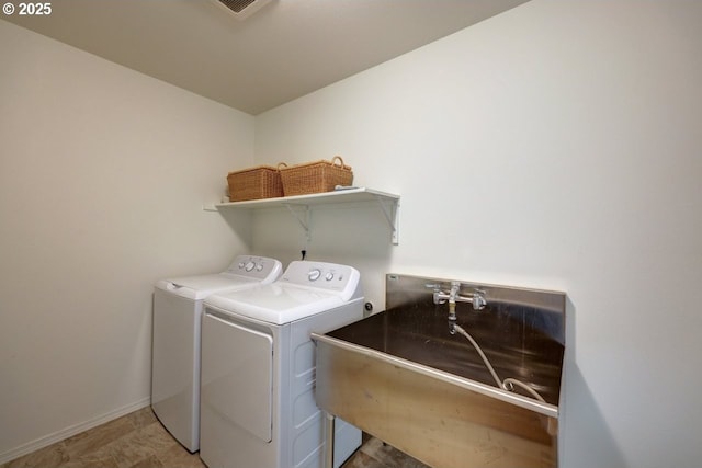 89650 Sea Breeze Dr, Warrenton, OR 97146 - washroom featuring washer and dryer and baseboards
