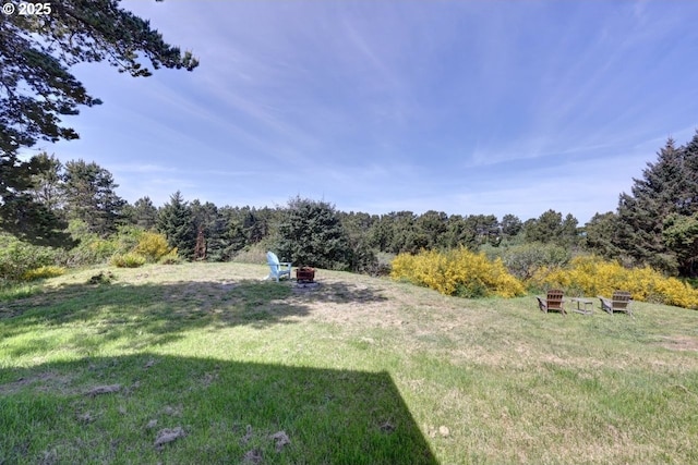 89650 Sea Breeze Dr, Warrenton, OR 97146 - view of grassy yard with a fire pit