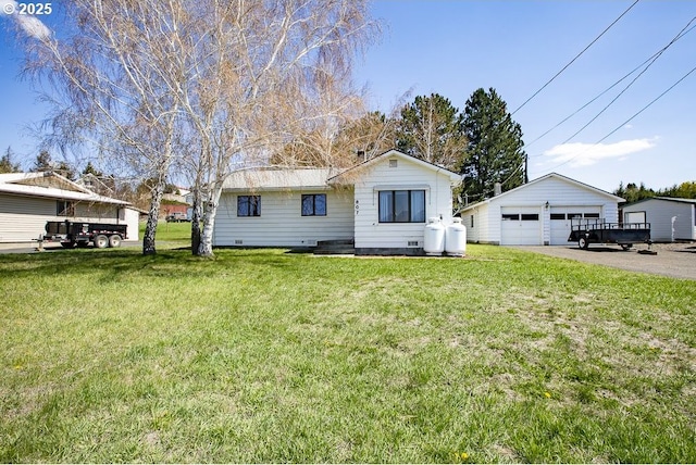 bungalow-style house with an outdoor structure, crawl space, a front lawn, and a garage