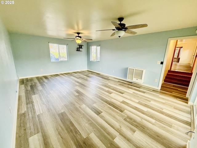 551 NW T St, Winston, OR 97496 - unfurnished room with light wood finished floors, ceiling fan, stairs, and baseboards
