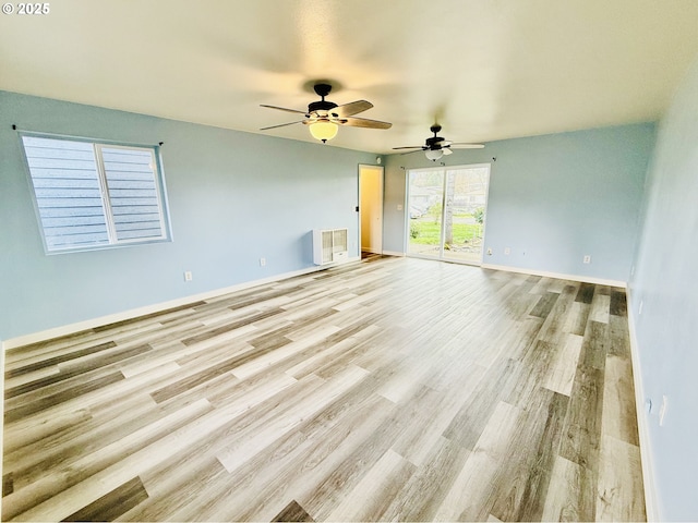 551 NW T St, Winston, OR 97496 - spare room with baseboards, a ceiling fan, and wood finished floors