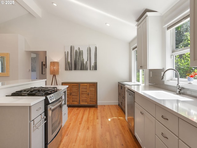 1720 Kilkenny Dr, Lake Oswego, OR 97034 - kitchen featuring appliances with stainless steel finishes, light wood-type flooring, light countertops, backsplash, and recessed lighting