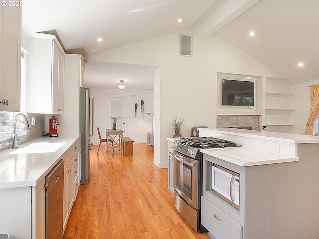 1720 Kilkenny Dr, Lake Oswego, OR 97034 - kitchen featuring stainless steel appliances, tasteful backsplash, light wood-style floors, light countertops, and recessed lighting
