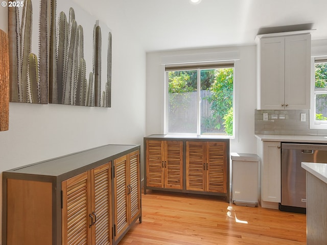 1720 Kilkenny Dr, Lake Oswego, OR 97034 - kitchen with dishwasher, light wood finished floors, decorative backsplash, and white cabinetry