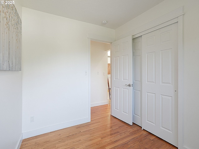 1720 Kilkenny Dr, Lake Oswego, OR 97034 - unfurnished bedroom featuring light wood-style floors and a closet