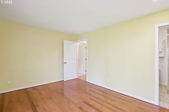 4621 SW Caldew St Unit D, Portland, OR 97219 - spare room with baseboards and wood finished floors