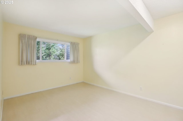 4621 SW Caldew St Unit D, Portland, OR 97219 - empty room with light carpet and baseboards