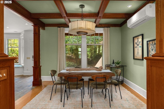 1620 NE Going St, Portland, OR 97211 - dining space featuring ornate columns, a wall mounted AC, light wood-type flooring, coffered ceiling, and beam ceiling