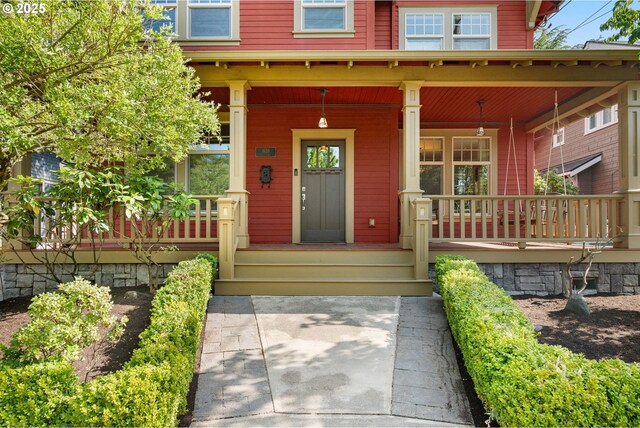 1620 NE Going St, Portland, OR 97211 - doorway to property featuring covered porch