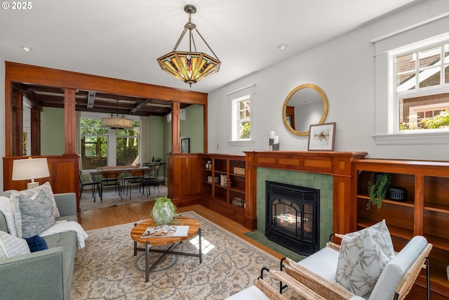 1620 NE Going St, Portland, OR 97211 - living area featuring healthy amount of natural light, wood finished floors, a tile fireplace, and recessed lighting
