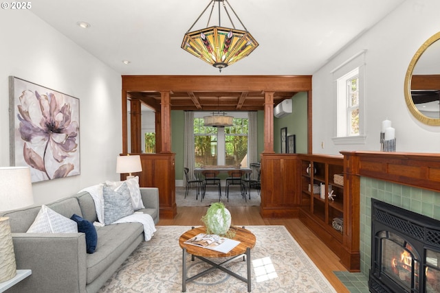 1620 NE Going St, Portland, OR 97211 - living room featuring light wood finished floors, a wall mounted air conditioner, recessed lighting, beamed ceiling, and coffered ceiling
