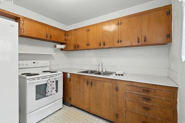 12130 SE Reedway St, Portland, OR 97266 - kitchen featuring white appliances, open shelves, light countertops, brown cabinets, and light floors