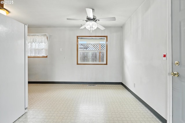 12130 SE Reedway St, Portland, OR 97266 - spare room with plenty of natural light, tile patterned floors, and ceiling fan