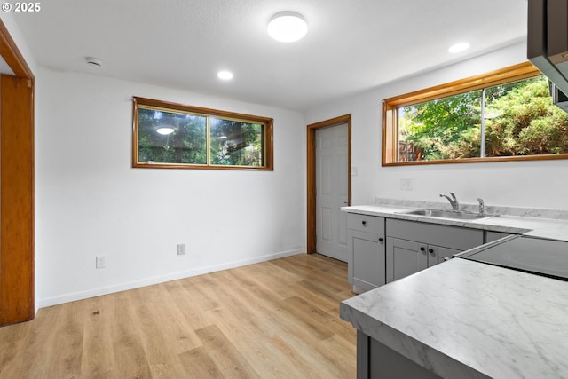 3602 NE 134th Ave, Portland, OR 97230 - kitchen featuring light wood finished floors, light countertops, recessed lighting, and gray cabinets