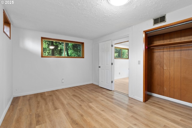 3602 NE 134th Ave, Portland, OR 97230 - unfurnished bedroom with light wood finished floors and a textured ceiling