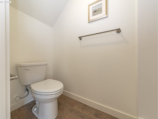 2366 Kingwood St, Forest Grove, OR 97116 - bathroom with lofted ceiling, toilet, baseboards, and wood finished floors