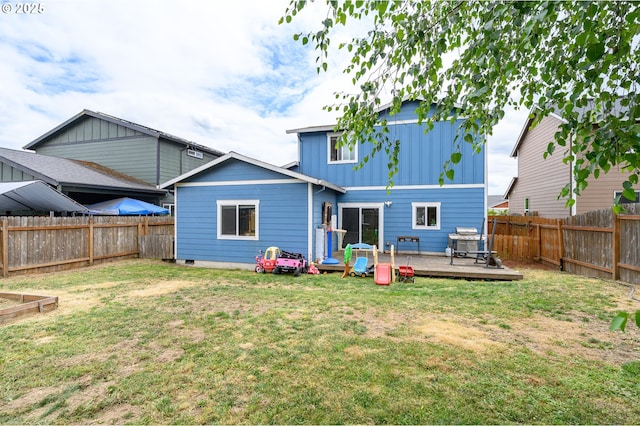 976 E 15th St, Lafayette, OR 97127 - back of house with a wooden deck, board and batten siding, and a fenced backyard