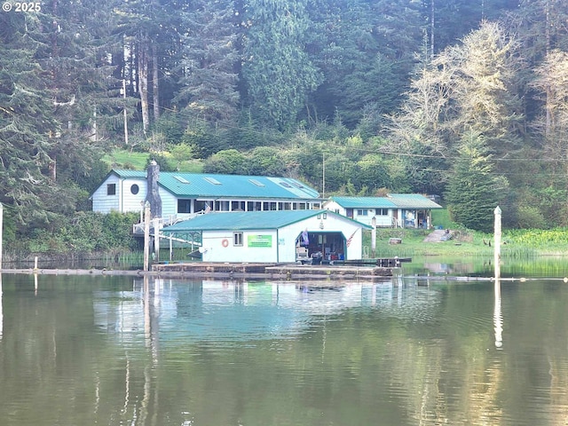 3062 S Tenmile, Lakeside, OR 97449 - water view with a dock, boat lift, and a forest