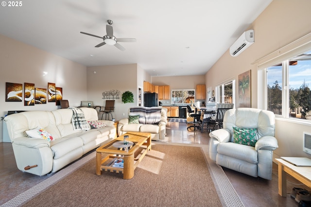 living room with an AC wall unit and ceiling fan