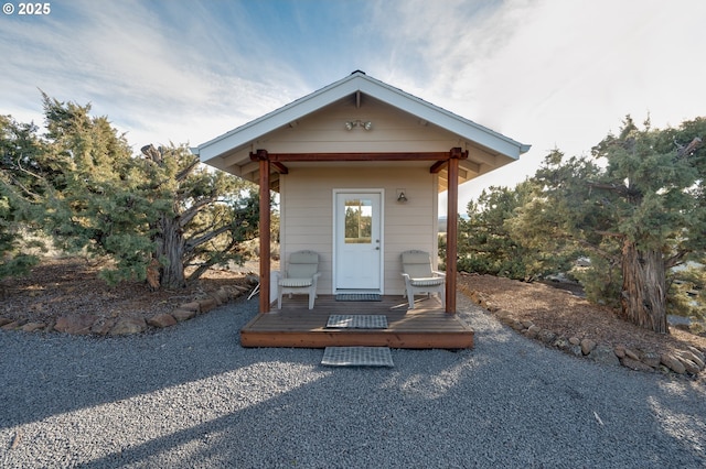 exterior space with a deck and an outbuilding