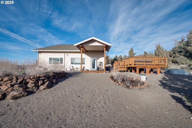 view of front of property featuring a wooden deck