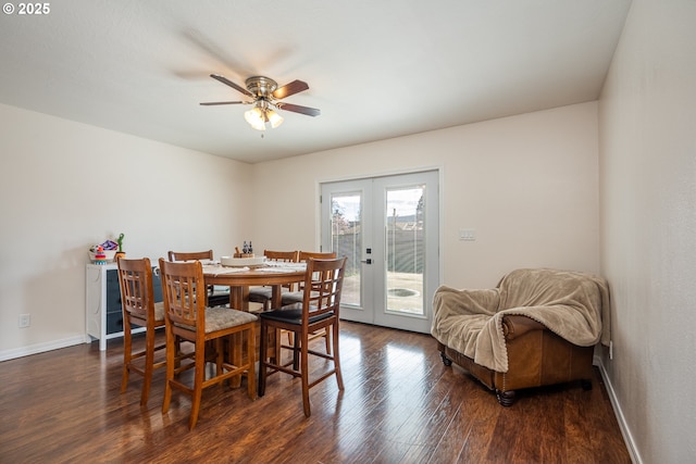 dining room featuring french doors, a ceiling fan, baseboards, and wood finished floors