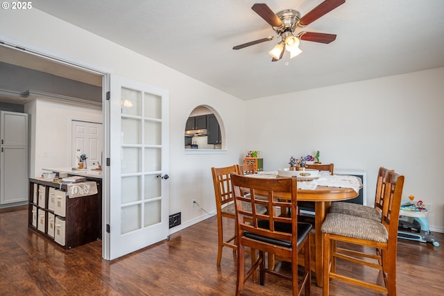 dining space featuring baseboards, ceiling fan, and wood finished floors