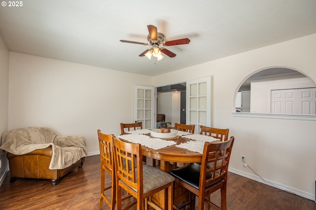 dining area featuring wood finished floors, baseboards, and ceiling fan