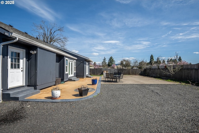 view of yard featuring a fenced backyard, a patio area, and entry steps